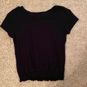 black slightly cropped shirt